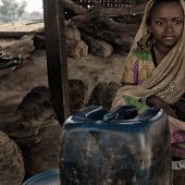 Cameroon/CAR refugees / Portrait of two unaccompanied children, brother and sister, taken on november 05, 2014, inside Adama's kitchen. Adama is a CAR refugee, cook of the Gado's refugees site and host family for orphans and unaccompagnied children. /UNHCR/O.Laban-Mattei/November 2014