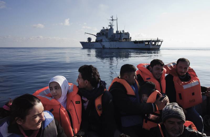 Italy. Syrian refugees are rescued in the Mediterranean Sea by crew of the Italian ship, Grecale. They will be transferred to a larger vessel, fed and given medical treatment before being transported to the mainland.  (c) UNHCR / A. D'Amato / March 2014.