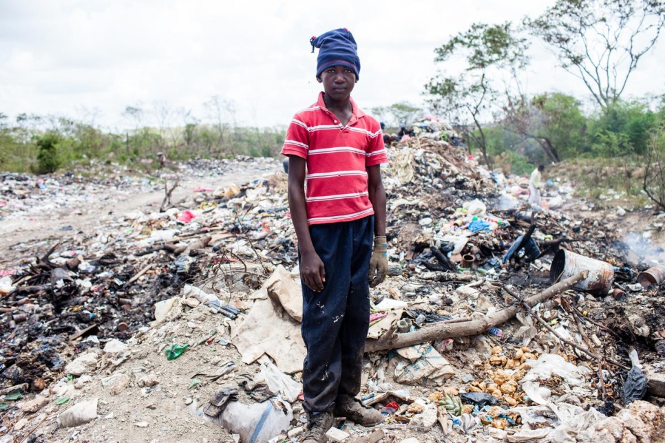 Like Joe, 13-year-old Adrian works at San Pedro de Macoris municipal dump during his summer vacations, looking for metal scraps.