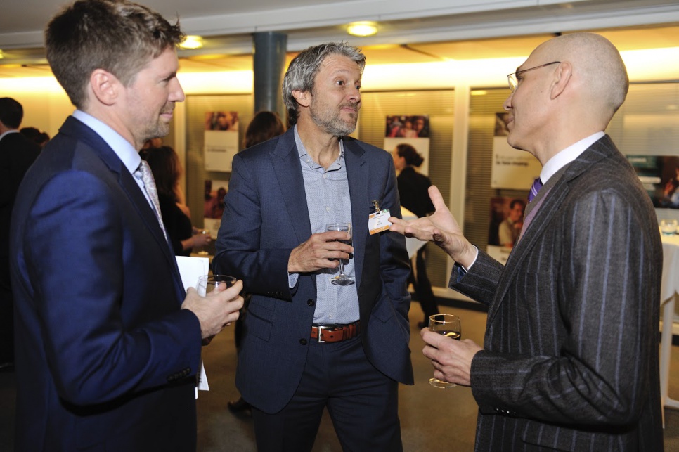 Reception in honour of members of UNHCR's inaugural Advisory Group on Gender, Forced Displacement and Protection. UNHCR Assistant High Commissioner Volker Türk, (at right), talking with advisory group member Gary Barker, from USA at center.