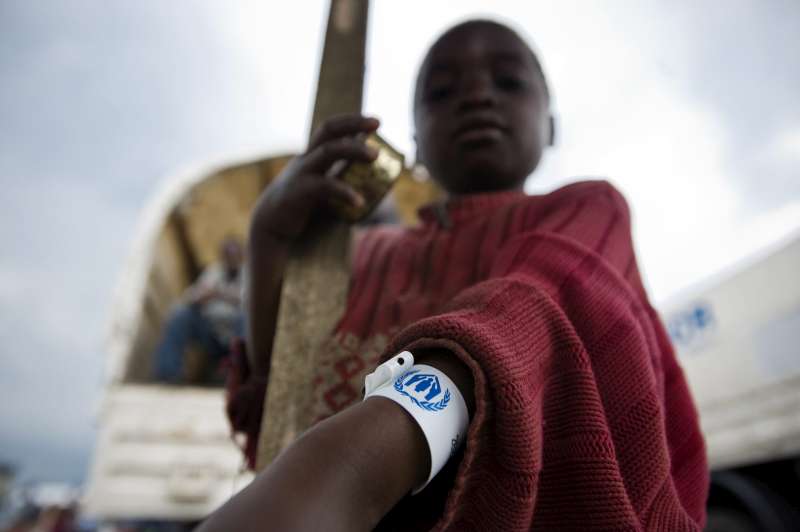 An internally displaced Congolese child displays his UNHCR arm tag prior to being transferred, along with other vulnerable civilians, to the Mugunga 1 camp in Democratic Republic of the Congo. 