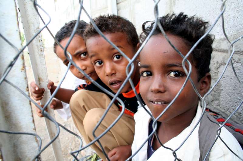 Young students who crossed the Gulf of Aden take a break at the elementary school in Kharaz refugee camp.
