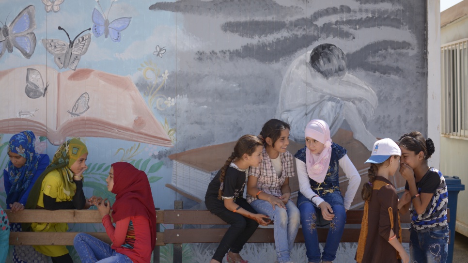 At Za'atari refugee camp young Syrian refugee girls gather for a meeting of TIGER (These Inspiring Girls Enjoy Reading) programme which targets refugee girls who have dropped out of school, or who are at risk of dropping out of school.