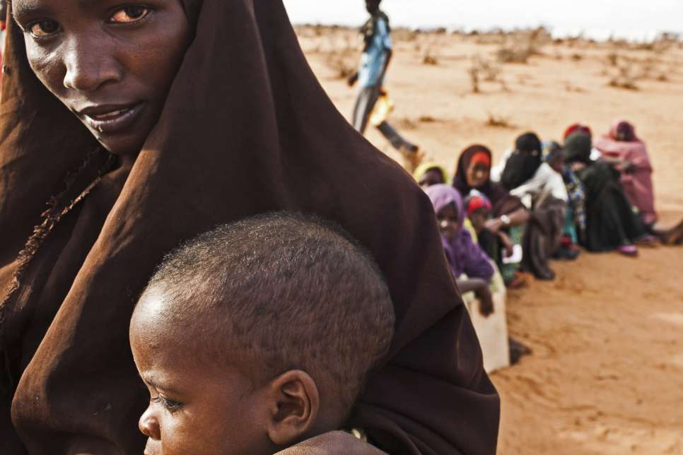 Somali refugees wait in line at the reception centre in Ifo camp in Dadaab, Kenya.