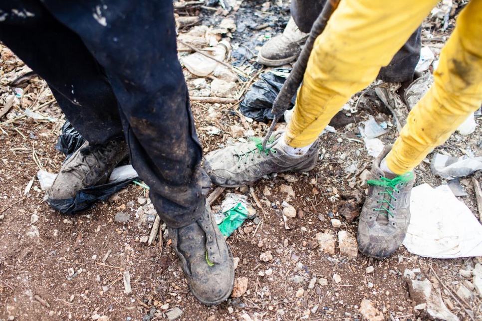 Joe and Adrian, both 13, work at San Pedro de Macoris municipal dump during their summer vacation.