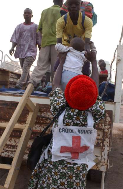 Angolan refugees in the Democratic Republic of the Congo board trucks at Divuma camp for the return home. 