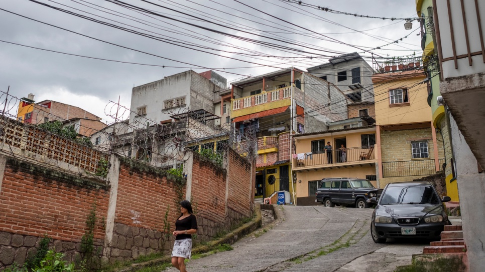 A resident walks in the El Bosque neighbourhood in central Tegucigalpa. The area is among many in the Honduran capital considered dangerous because of the presence of local gangs known as "maras."