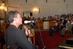 UNHCR Goodwill Ambassador George Dalaras plays guitar and sings to dignitaries attending his induction ceremony in Athens on October 5, 2006.