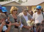 Goodwill Ambassador George Dalaras (with flowers), his wife Anna and UNHCR staff at a welcoming ceremony in a Sierra Leone refugee camp.