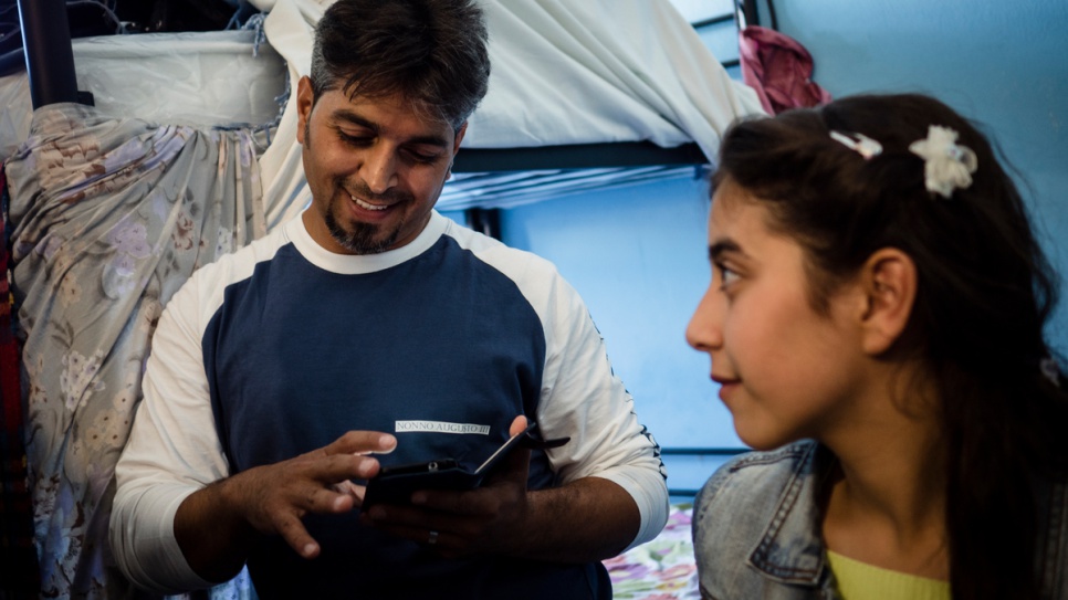 Bashar places a call to his son, Riyad, who is in Germany with his mother, while Ensaf listens in.