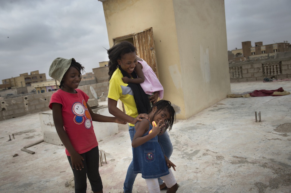 Budiaki and her daughters play on the terrace of their rented house in Basra, a suburb of Noauakchott.