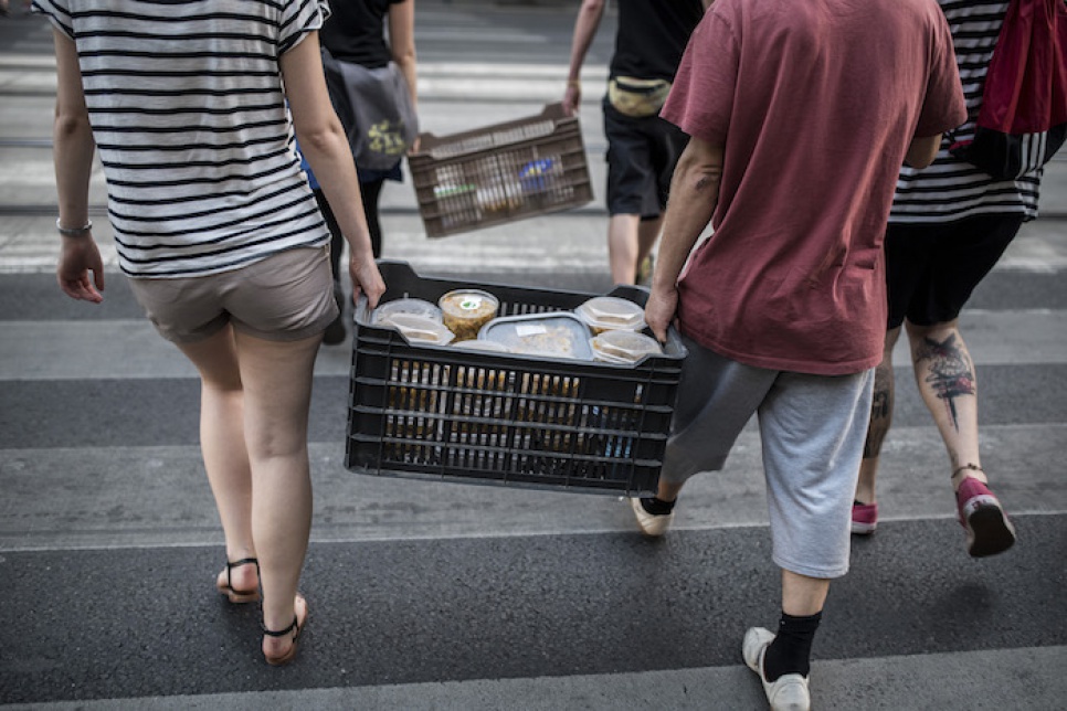 Volunteers carry the food they have cooked to the centre of Budapest, where they will distribute it to exhausted asylum-seekers.