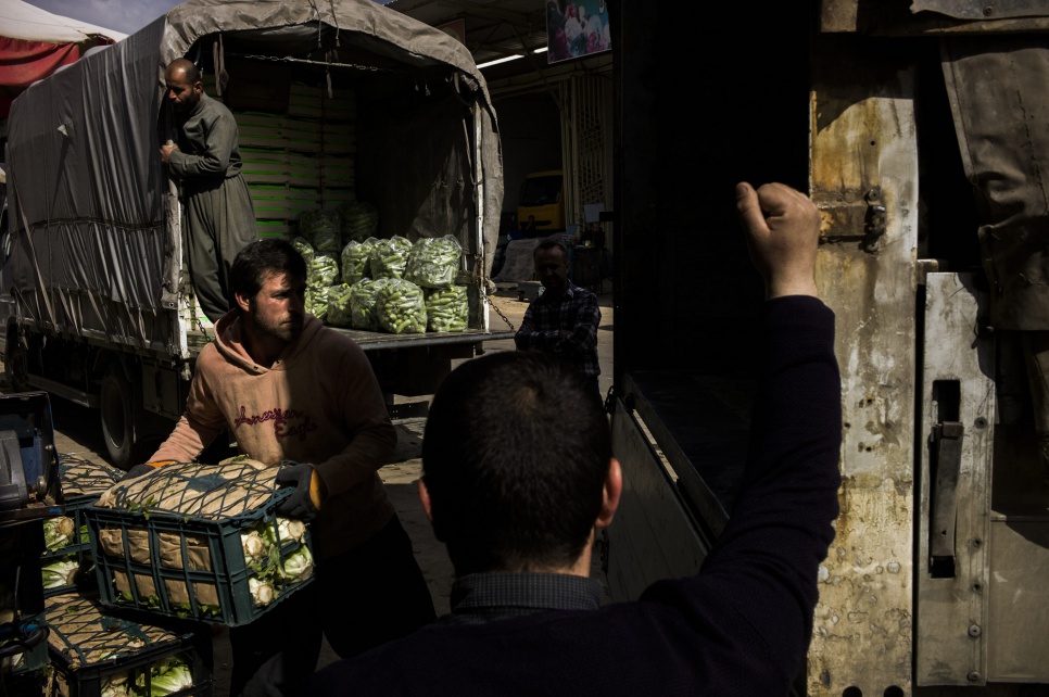 Ronak earns about US $100 a week, which helps support his wife and daughters. But jobs like this are seasonal. In winter, work at the vegetable market almost grinds to a halt.