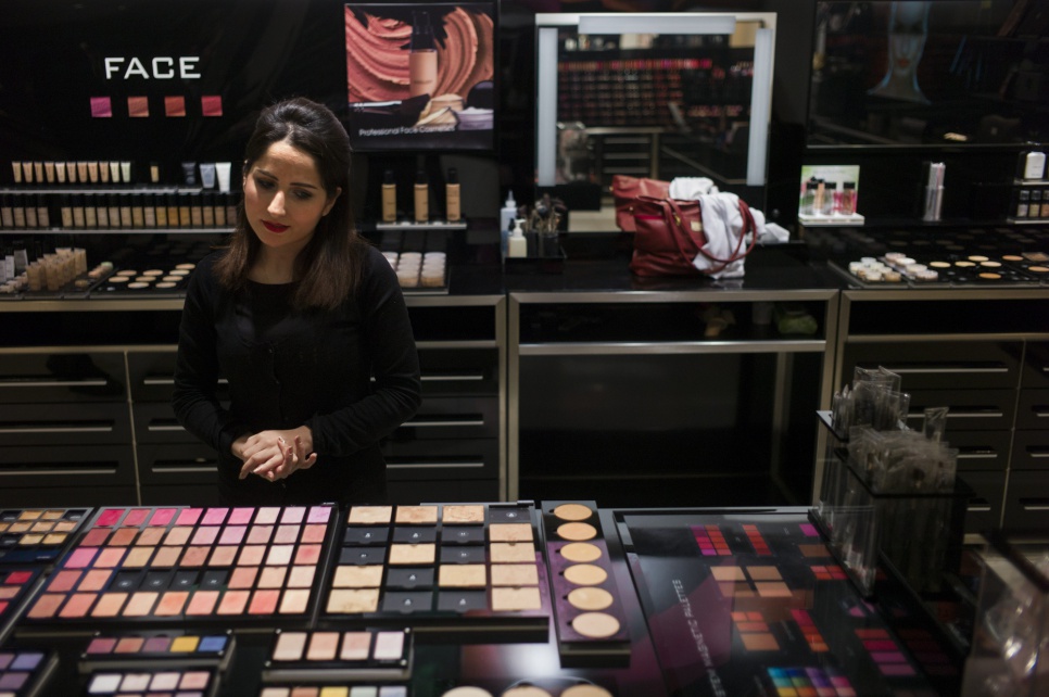 Simav, 22, had been studying law in Qamishli when violence in Syria forced her family to flee to Iraq. Now she works at a make-up counter in an Erbil shopping mall.