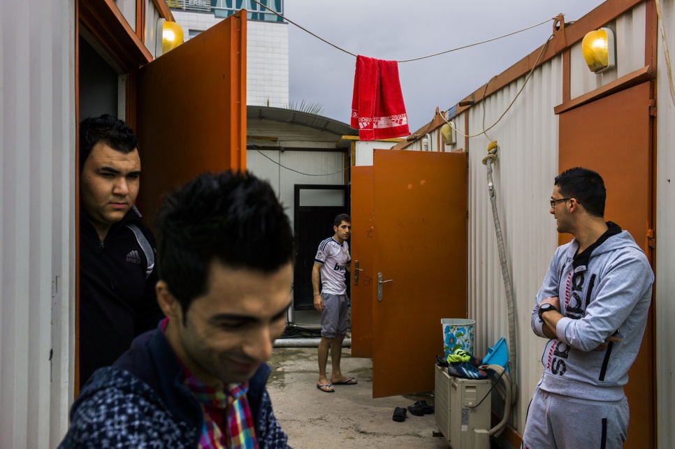Rudy (foreground) works at a midrange hotel in Erbil, in the Kurdistan Region of Iraq. He and his co-workers, live in prefab containers on the hotel grounds.
