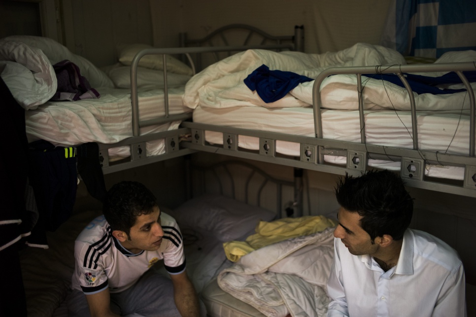 Rudy (right) shares a room with several other Syrian refugees who work at the hotel in Erbil, in the Kurdistan Region of Iraq.