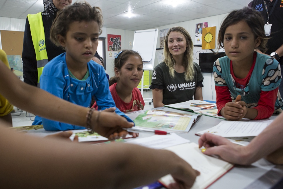 "Let me introduce you to this group of young girls I met in a Community Center in Azraq refugee camp. They were a bundle of smiles and very curious about us and who we were. They told me about how much they love to come to the center so they can meet their friends and read books together. They showed me how to write their names in Arabic and in English. When I got up to leave a couple of them slipped their hands into mine and followed me around for the rest of my time there. I was very touched by their immediate trust and the love they showed me. " 