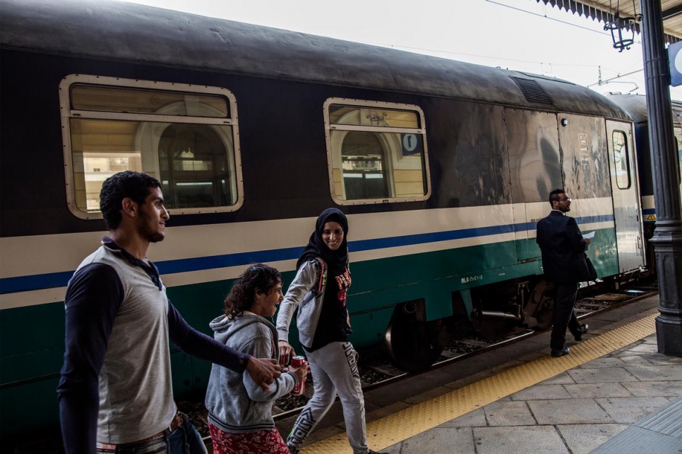 Amal, Diana and Abdo board a train to Milan from Syracuse station in Sicily.