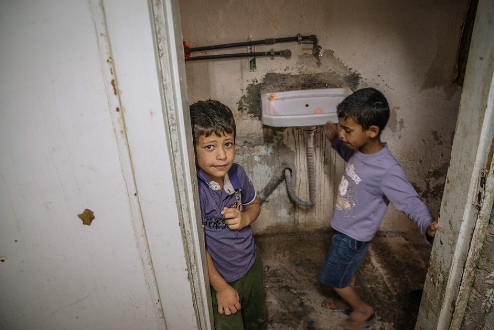 Syrian refugee cousins Muhaned, 7, and Sultan, 6, in their apartment in Mafraq, Jordan.