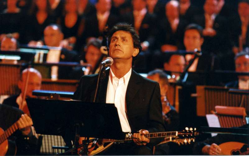 UNHCR Goodwill Ambassador George Dalaras performs in Athens at the ancient Herod Atticus theatre during one of two high-profile benefit concerts he gave in 2001 to mark UNHCR's 50th Anniversary commemorations.