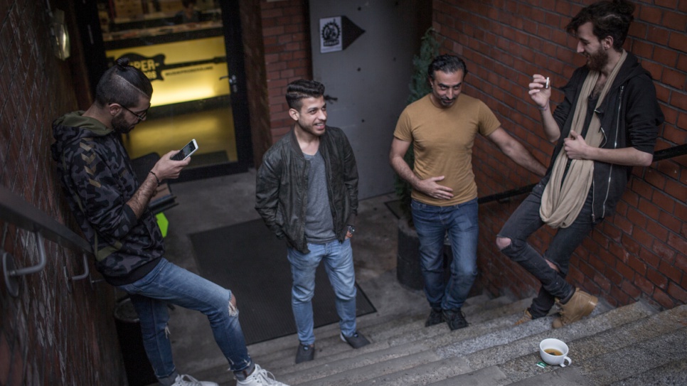 Musiqana band members Alaa Zaitouna, Abdallah Rahal, Adel Sabawi and Ali Hasan take a break from practicing. The four Syrian refugees are delighting German audiences with traditional Arabic music.