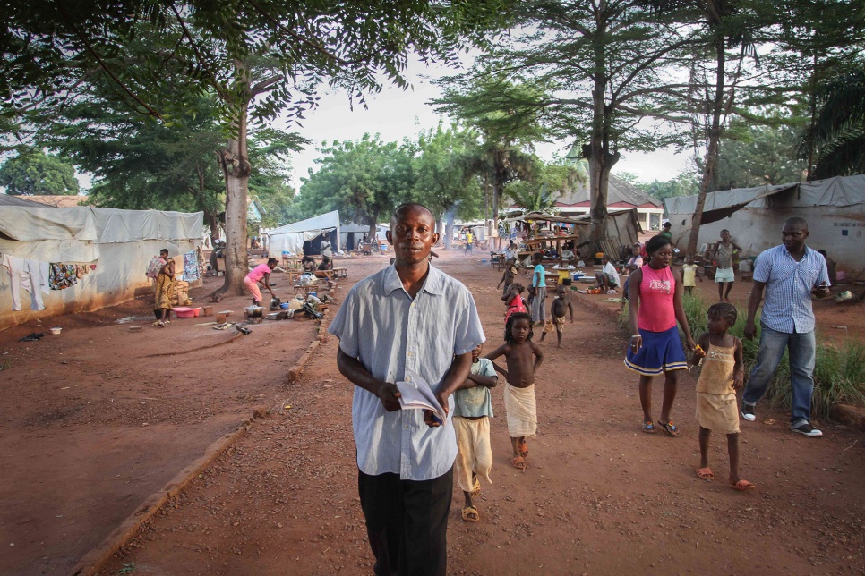 Gildas walks through the Grand Séminaire camp in Bangui. "Our duty is to provide these kids with a good education. It's essential for them to grow up and help in rebuilding our country."