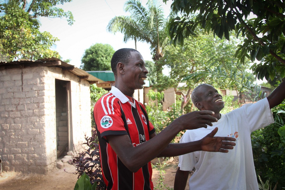 Ambroise and his son-in-law, Eric, are cultivating fruit trees near their temporary home. "Gardening gives me the sense of perpetuity and heritage," Ambroise says.