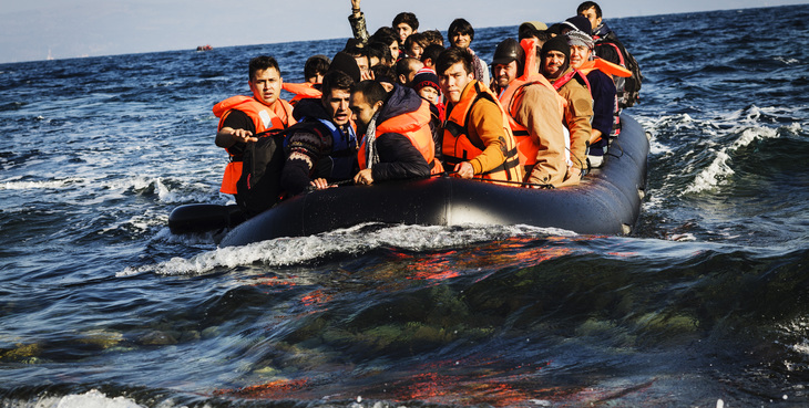 A boat full and refugees and migrants reaches the shores of Lesbos, after crossing the Aegean sea from Turkey.