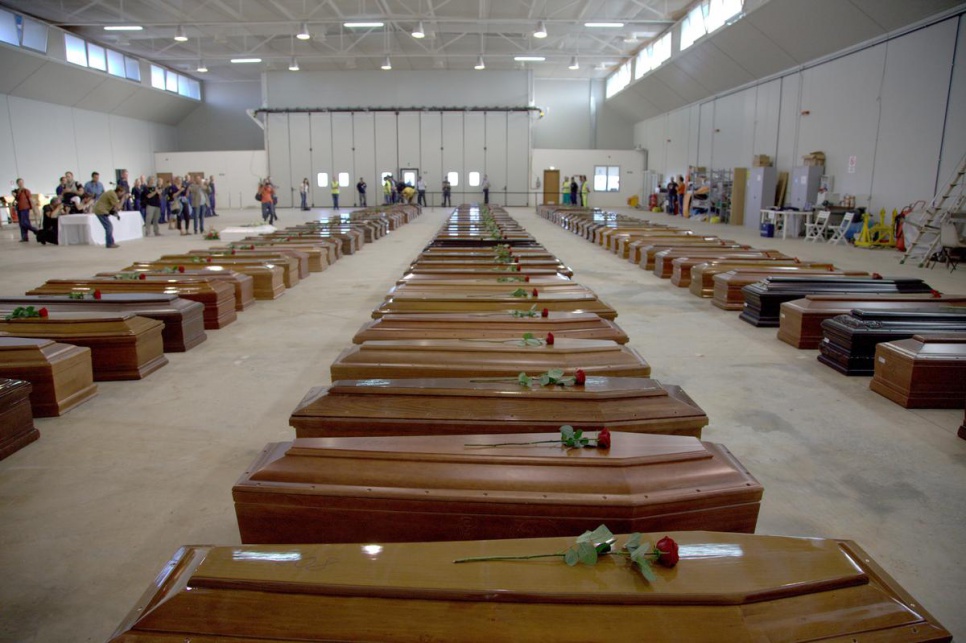 Coffins contain the bodies of refugees and migrants who perished in October 2013, when their boat sank near the Italian island of Lampedusa.