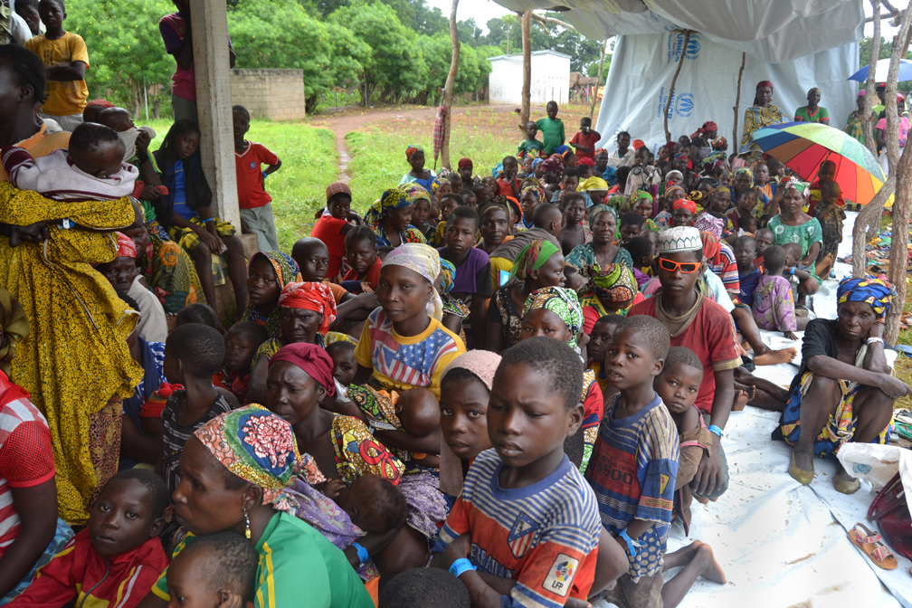 Refugee women and children wait to be registered in the Chadian village of Mini. They fled fresh clashes between armed groups in Ngaoundaye, in the north-west of the Central African Republic. 