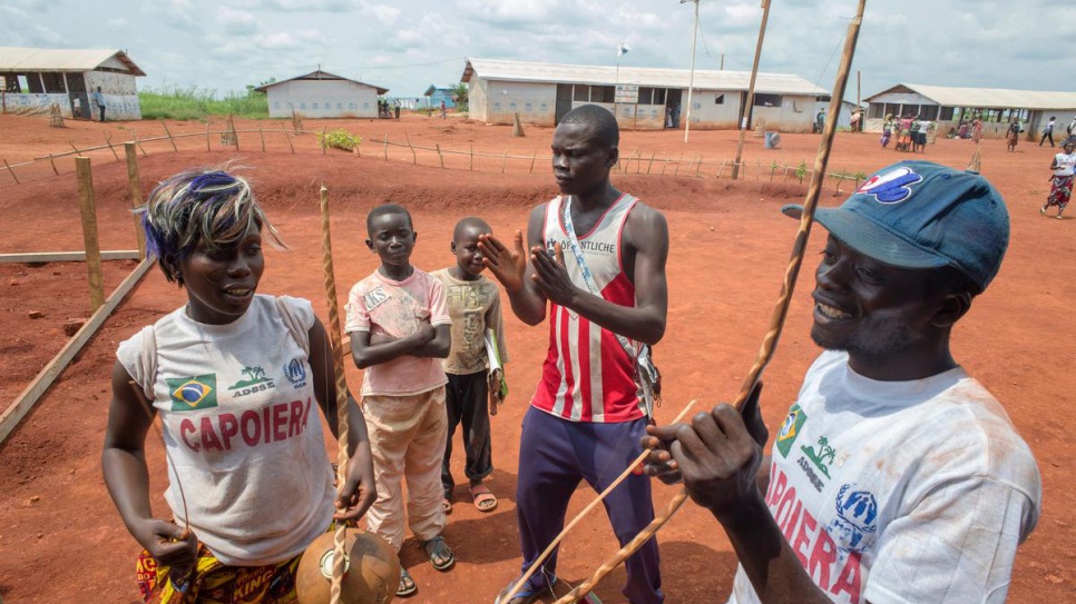 Central African refugees play music following capoiera practice at Mole camp.