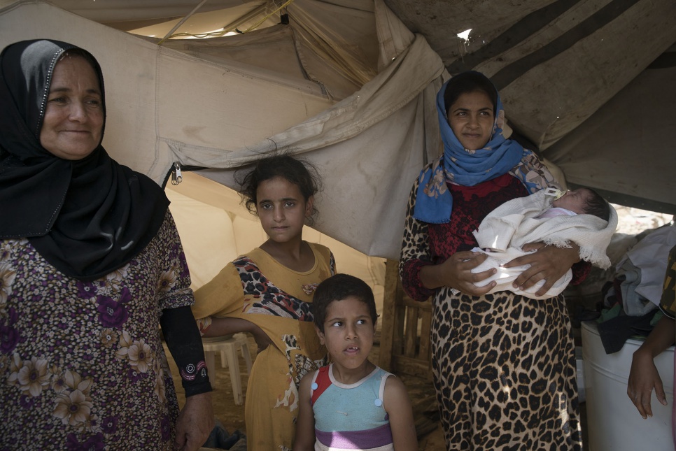 Nahla (left), her daughter-in-law Abeer (right) and Abeer's children were allowed to cross Bzeibiz Bridge after fleeing violence in Fallujah. They found shelter in a makeshift camp.