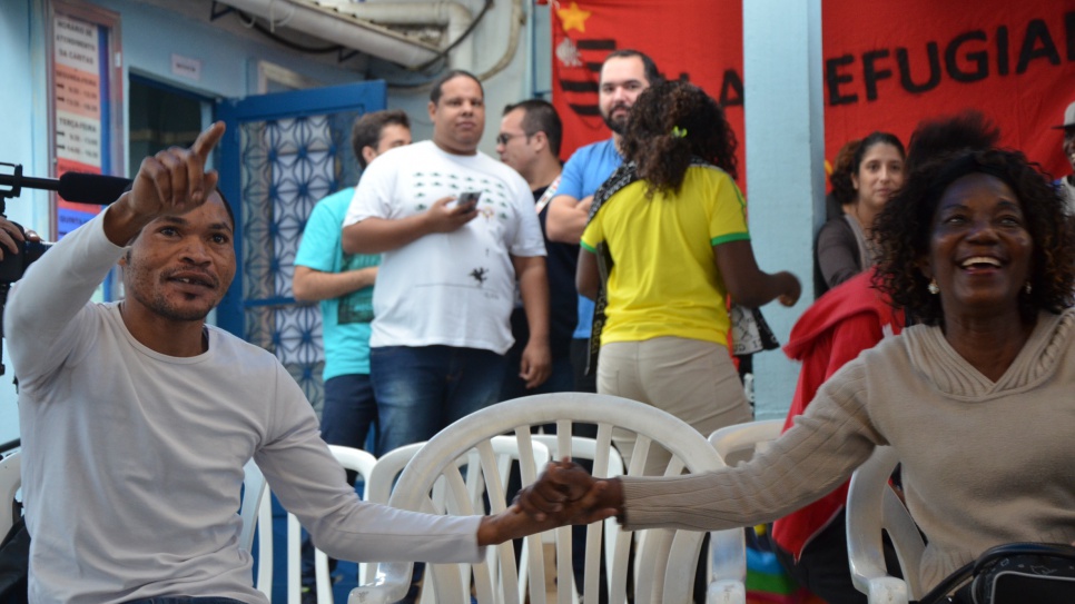 Congolese refugees in Rio celebrate Popole's Olympic victory.