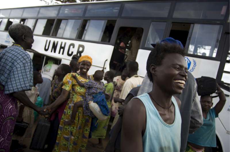 Sudanese refugees celebrate their return to their home village of Moli in South Sudan. Many of them have lived as refugees in Uganda for more than a decade. 