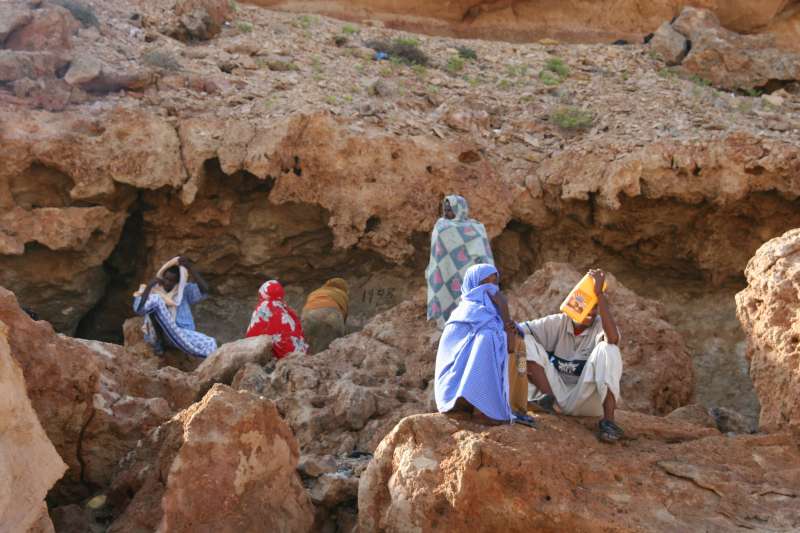 In the cliffs of Mareero, outside Bossaso, Somalis wait for the evening departure of the smuggler's boat they hope will take them to Yemen.