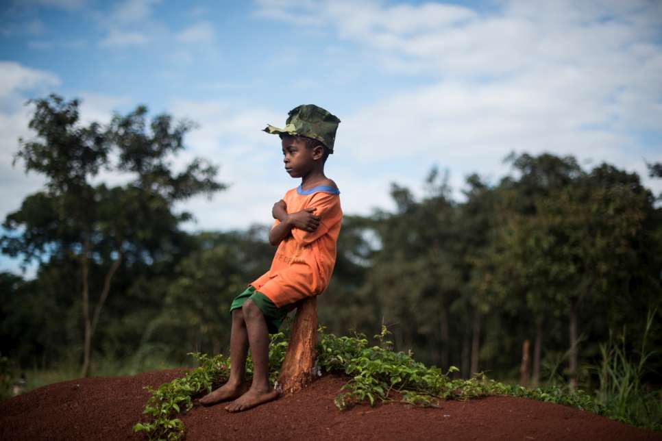 Six-year-old Jehovaness Tsinzi proudly wears a hat made of avocado leaves. More than a quarter of a million Burundians have fled to neighbouring countries since 25 April 2015.