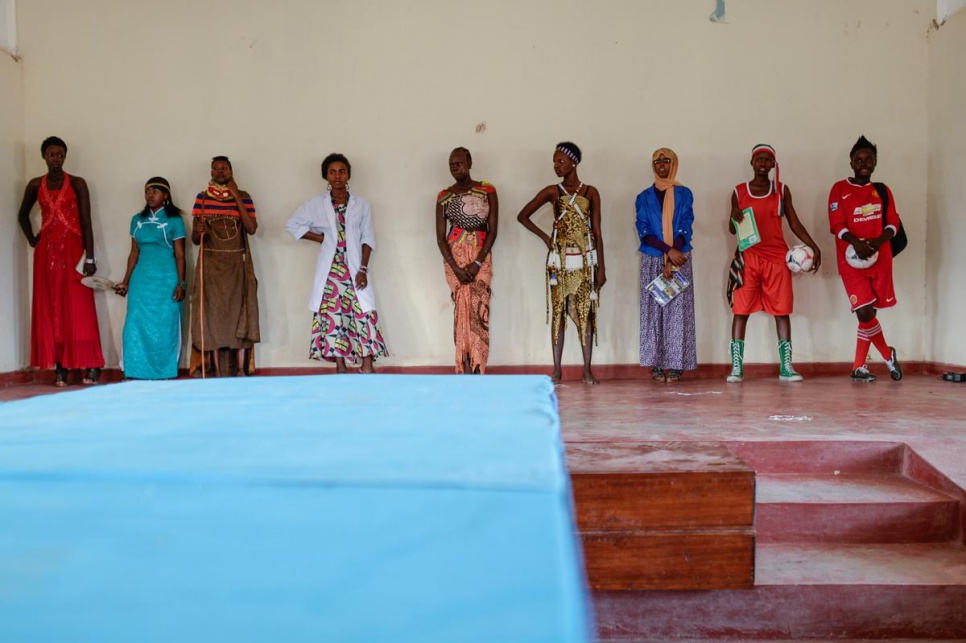 It's not all study at school. Esther Nyakong (far right) and eight other students perform as models during recreation time.