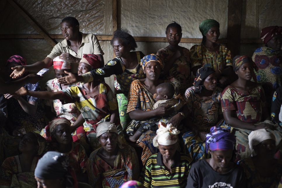 Displaced Congolese women, some of whom are sex workers, attend a meeting about sexual violence and condom distribution in Kilimani IDP camp, Masisi.