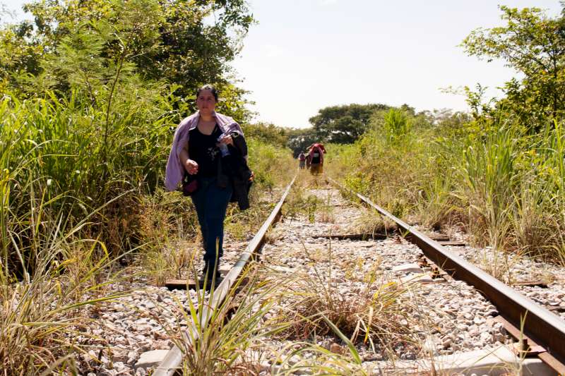 A woman from El Salvador walks along train tracks in Chiapas, Mexico, October 2015.