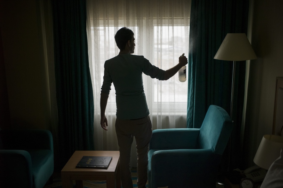 A Syrian refugee cleans a hotel room in Erbil. Syrians are bringing their skills to the Kurdistan Region of Iraq, and in doing so transforming the region's economy.