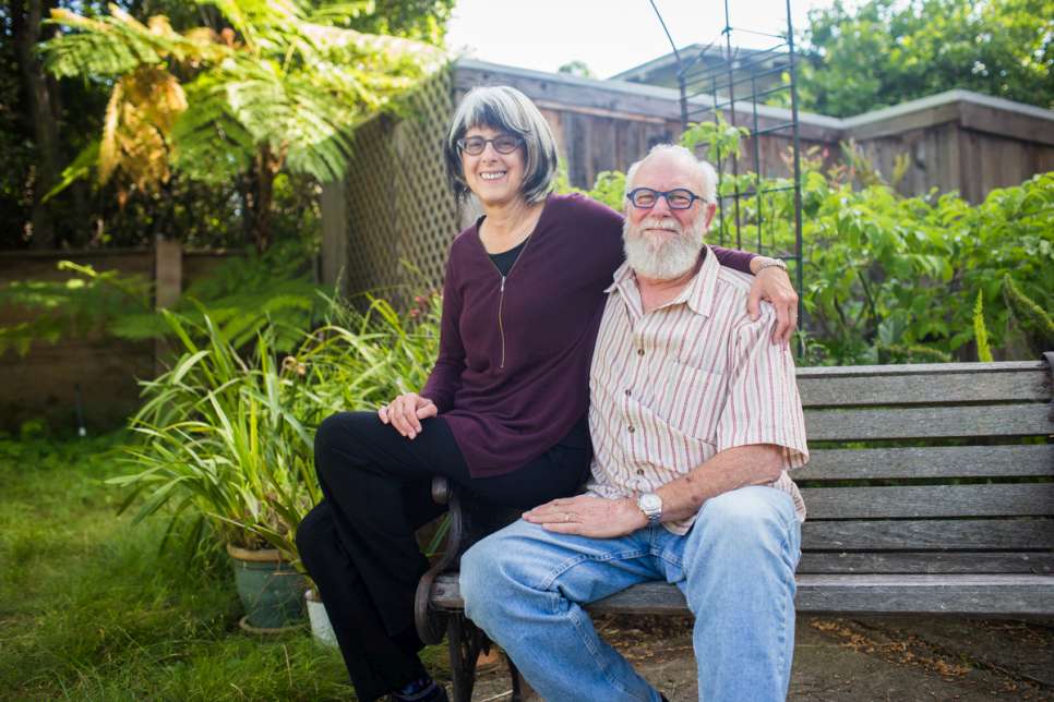 Judy Salomon, a grade-school teacher from Berkeley, at home with her husband. "Our Ugandan guests were scared at first," she says, but that changed when they met her grandchildren. 
