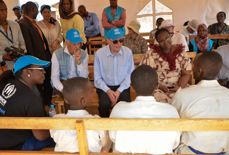 Representative of UNHCR Mr. Azam Saber, Dr. Jacques Rogge and Minister Seraphine Mukantabana in a short conversation with the martial arts team (Karate/ Wadō-ryū) in Mahama refugee camp [Photo/ IOC Shaban Masengesho] 