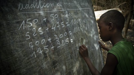 Republic of Congo / Democratic Republic of Congo (DRC) refugees in the Republic of Congo (RoC) / Yoi Na Yoi, 20 kilometers north from Impofndo. Pupil doing a mathematic exercise at the blackbooard, in one of the six classrooms in the refugees' school of Malala, built by the refugees in one month, on a plot given by the local village chief. 245 pupils are ofllowing courses there (136 girls and 109 boys) since 1st february. The teachers are all refugees and were teachers in DRC. The curriculum is different between DRC and RoC. Refugees' school use the DRC one (the same than Belgium), complicating the purchase of books and banning the sharing of classrooms with local pupils. The courses are given only during a morning session. / UNHCR / Frederic NOY / February 2010