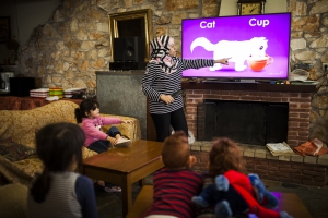 35-year-old Menar, a Syrian refugee who fled Syria with her 3 children, teaches an English language course to a group of young children who's families are waiting for their relocation case to be examined. 