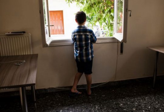 Mohamed Barri, looks out of the window of the apartment he shares with his mother, siblings and grandparents while they wait to be reunited with Mohamed's father in Germany. The Barri family received a visit from the UN High Commissioner for Refugees Filippo Grandi at the apartment in Athens they are staying in under Greece’s refugee accommodation programme. One family member was killed when their house and bakery business were bombed and they decided to flee Aleppo in February 2016 when another family member was kidnapped. Half of the family will be relocated to France and the others to Germany.