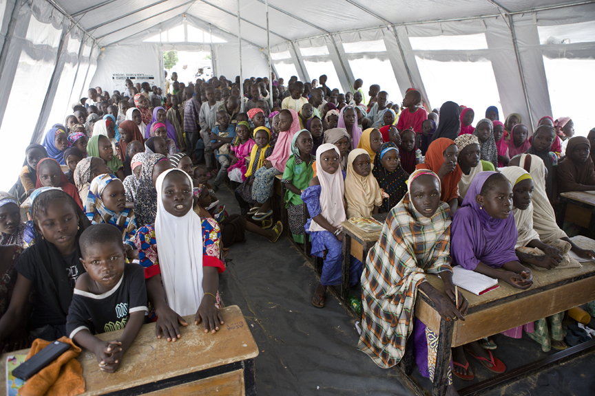 UNICEF has erected two big tents to provide classrooms, which are overcrowded with more than 130 pupils per tent. The security situation remains volatile in the surroundings of Gwoza, and teachers, doctors, and local authorities have not yet fully retumed to the city. © UNHCR / Helene Caux