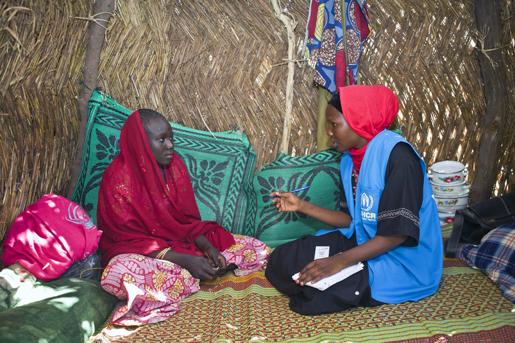 A UNHCR monitor interviews a displaced woman in Kuya camp, Monguno, about her needs and protection concerns. UNHCR teams found out that many families were headed by women because their husbands had been killed by Boko Haram, forced to join the insurgents or just disappeared in conflict. Many women and children remain traumatized by their time under Boko Haram rule. They and their children need counselling and livelihoods support. Food shortages, lack of decent shelters and rampant malnutriton among children are also major concerns. UNHCR / Helene Caux