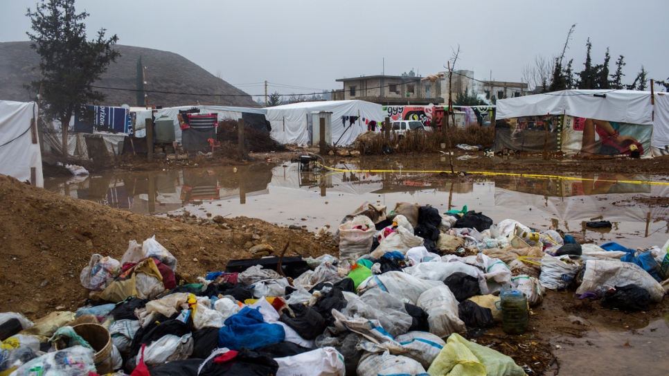 Garbage bags pile up on the roadside at an informal settlement in Tal Sarhoun, Bekaa Valley. 