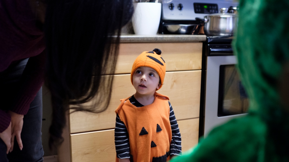 Ahmad Arafat dresses up as a pumpkin for his first Halloween.