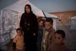 Displaced Iraqi mother Bade reaches the newly opened Laylan 2 camp, so...